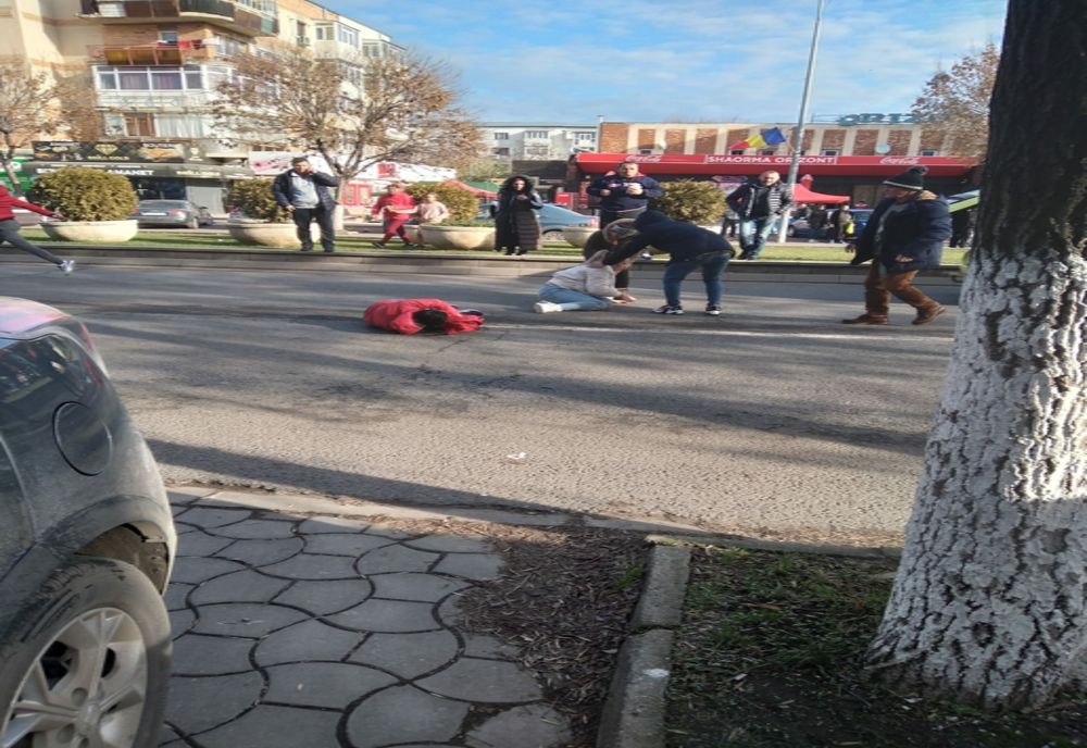 Femeie spulberată pe trecerea de pietoni